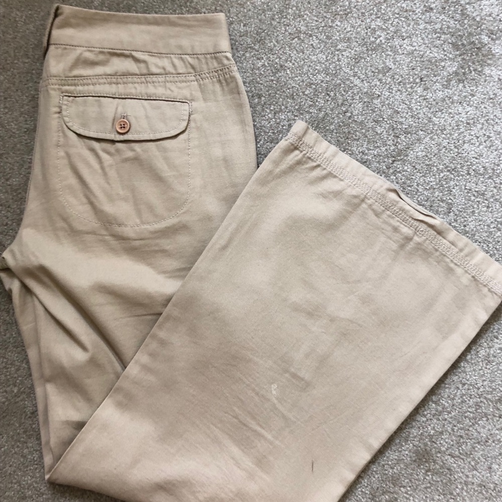 DKNY khaki pants with side pockets and zips.
